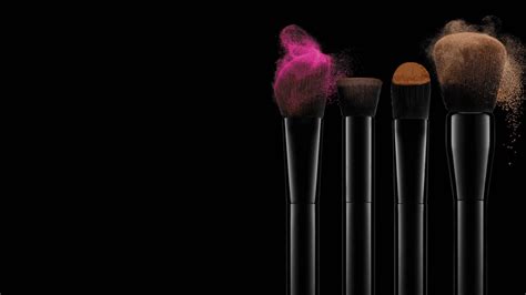 Brushes With Coloured Make Up On A Dark Background Wallpaper Download