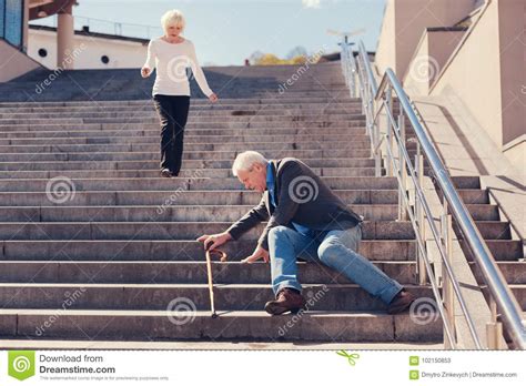 Loving Wife Rushing Down Stairs To Help Husband Stock Image - Image of ...