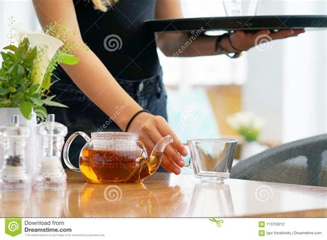 The Waitress Gives Tea To The Client Stock Photo Image Of Glass Cafe