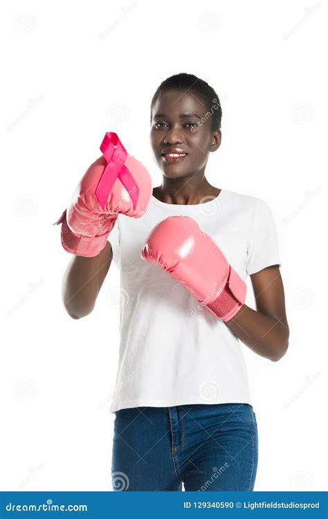 Attractive African American Girl In Boxing Gloves Holding Pink Ribbon