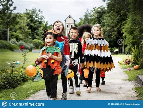 Young Kids Trick Or Treating During Halloween Stock Photo Image Of