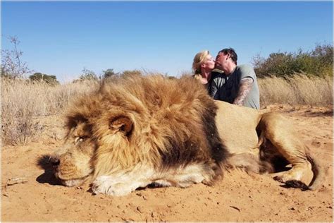 Horrifying Photo Shows Sick Trophy Hunting Couple Kiss Over Corpse Of