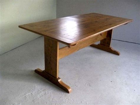 The trestle legs and tabletop are solid wood. Trestle Farm Tables