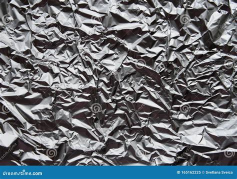 Crumpled Silver Aluminum Foil Closeup Background Texture Abstract