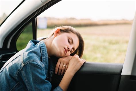 Young Woman Sleeping In Car Free Photo