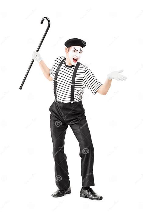 Full Length Portrait Of A Mime Artist Holding A Cane And Gesturing