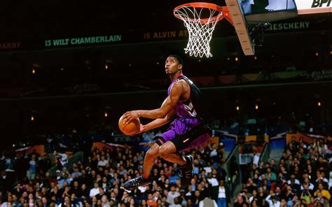 Download Bryan Mcgrady Flying Through The Air In A Slam Dunk Wallpaper