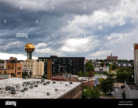 The Cityscape Of Downtown Knoxville Tennessee Against A Cloudy Sky