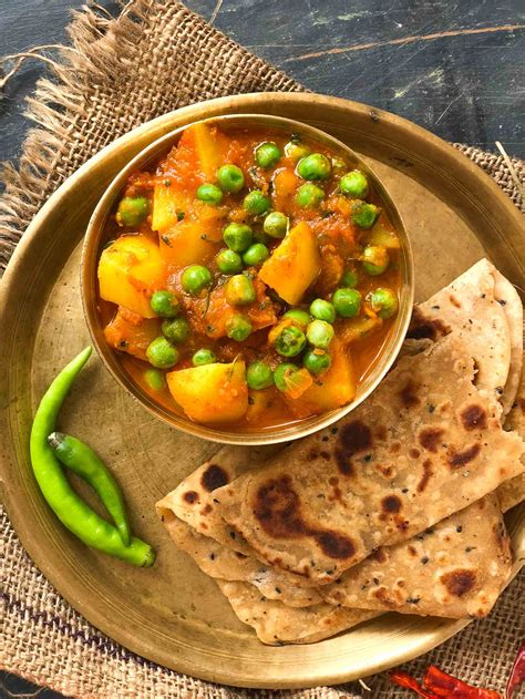 Aloo Matar Sabzi Recipe Potatoes Peas In Tomato Gravy By Archanas