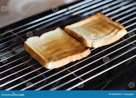 Toast bread on toaster stock image. Image of modern, machine - 96668923