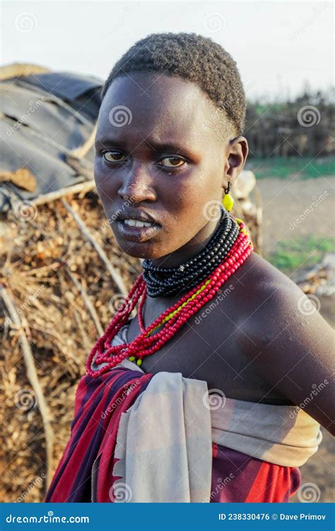 Close Up Portrait Of Dassanech Tribe Woman With Traditional Bright