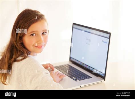 Young Girl Working On Laptop Stock Photo Alamy