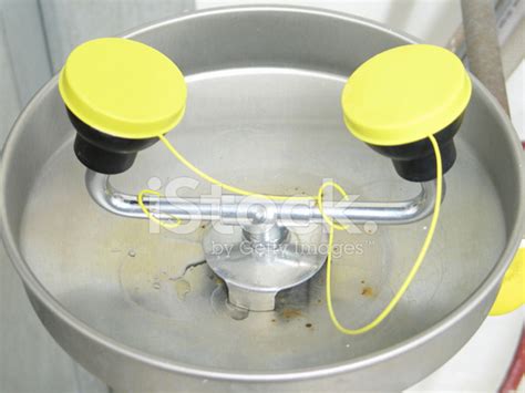 Eye Wash Station With Yellow Caps And Metal Fountain Like Bowl Stock