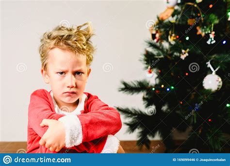 Child With Disguise Anxious And Sad On Christmas Day With An Angry