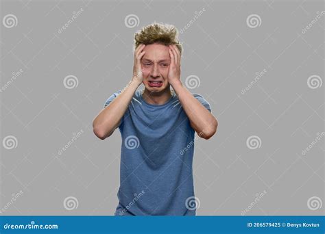 Depressed Teen Boy Crying On Gray Background Stock Image Image Of