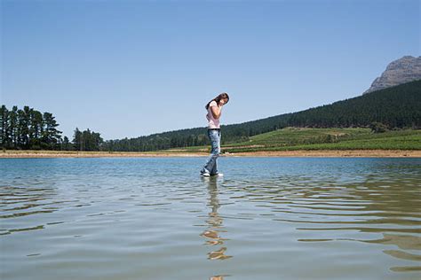 Woman Walking On Water Stock Photos Pictures And Royalty Free Images