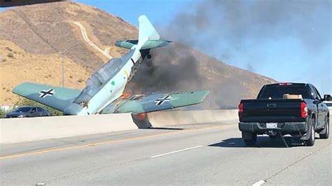 Vintage Plane Erupts In Flames After Crashing Onto Freeway In Southern