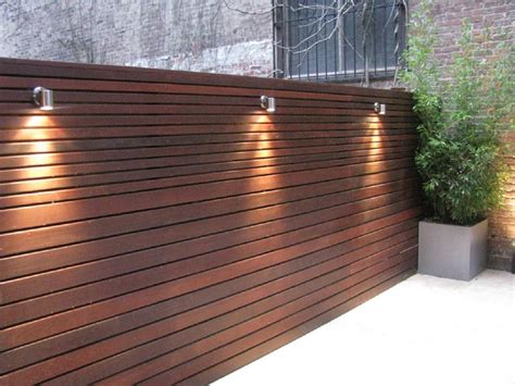 How to build a small pond diy. Urban backyard ipe wooden horizontal board fence with lighting