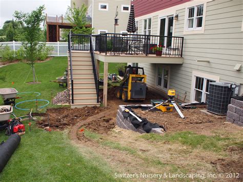 Paver Patio Under Deck With Retaining Wall And Steps A Photo On Flickriver