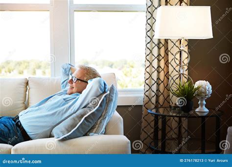 Soaking Up The Freedom Of Retirement A Happy Mature Man Relaxing On