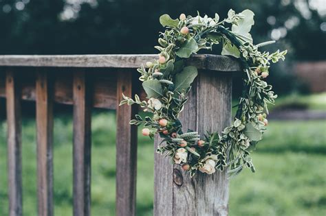 A Flower Crown Hanging From A Wooden Balustrade Floral Wreath 4k Hd