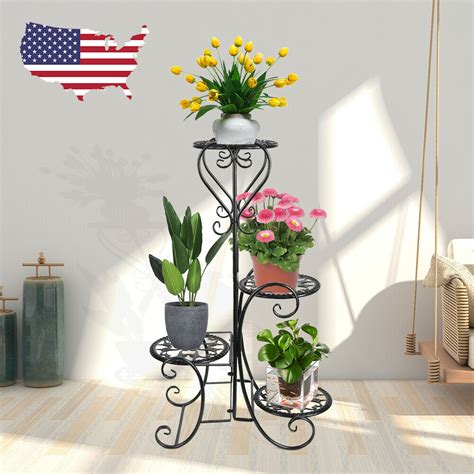 View our range of outdoor flower pots: 4 TIER Metal Shelves Flower Pot Plant Stand Display Indoor ...