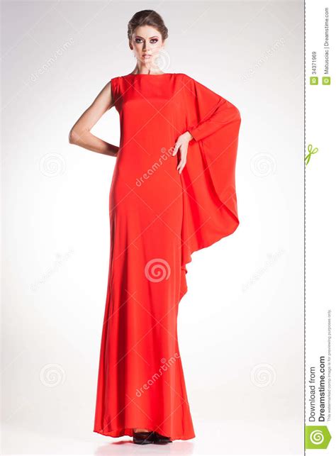 Beautiful Woman Model Posing In Simple Elegant Red Dress