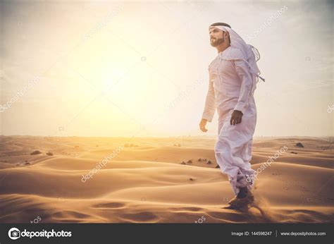 Arabian Man In Desert Stock Photo By ©oneinchpunch 144598247
