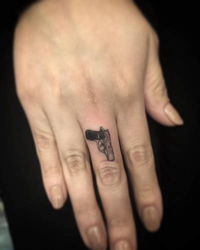 Gun Tattoo On Hand Best Tattoo Ideas