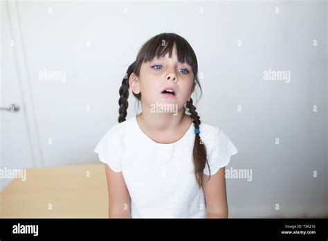 6 7 Years Old Child With A Bored Facial Expression Stock Photo Alamy