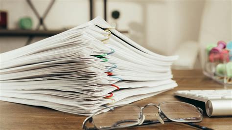 A Close Up Shot Of Paper Clipped Documents · Free Stock Photo