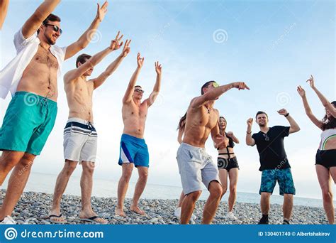 Friends Dance On Beach Under Sunset Sunlight Having Fun Happy Enjoy