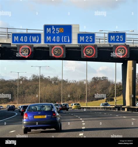 Variable Speed Limit Signs On Overhead Gantry Illuminated On M25