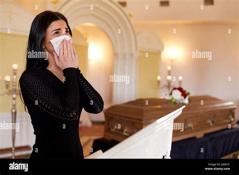 Woman With Coffin Crying At Funeral In Church Stock Photo Alamy