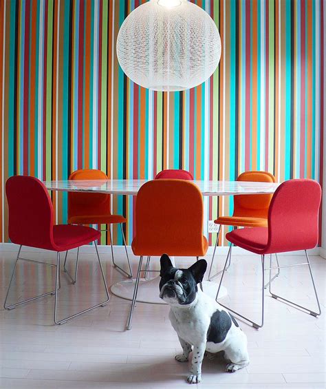 Pour wallpaper paste into paint pan, slide roller pad onto roller handle, then dip roller into pan. 10 Dining Rooms with Snazzy Striped Accent Walls