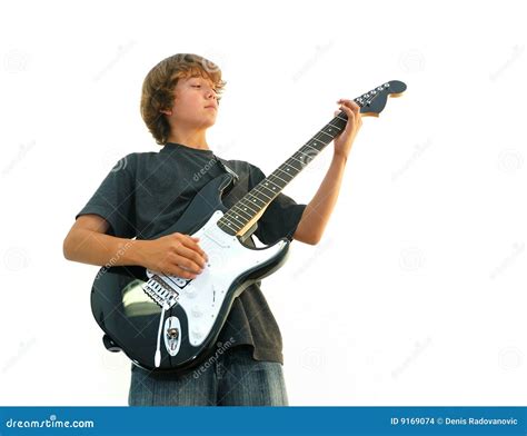 Muchacho Adolescente Que Toca La Guitarra Foto De Archivo Imagen De