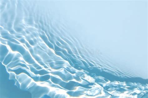 Transparent Blue Colored Clear Calm Water Surface Texture Stock Photo