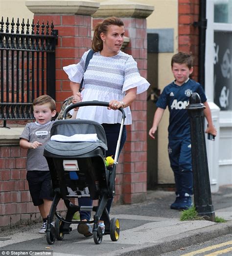 coleen rooney looks chic as she steps out with her sons kai klay and kit daily mail online