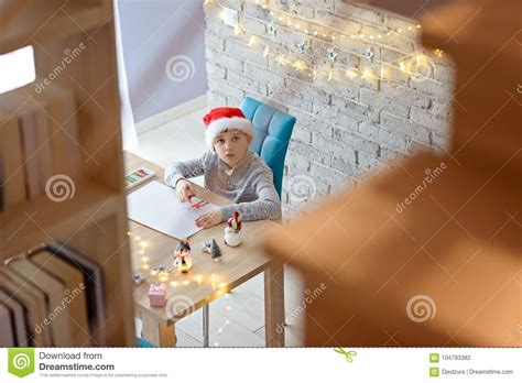 Child In Santa Claus Cap Drawing A Pastel Drawing For