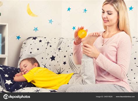 Mom Does Foot Massage Her Son Stock Photo By Koltsovthebest