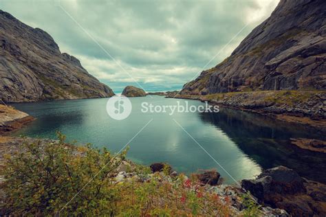 Fjord In Evening In Rainy Day Rocky Beach Beautiful Nature Of Norway
