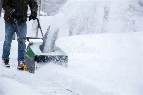 Snowblower In Action During A Snowstorm In The Blizzard Stock Image