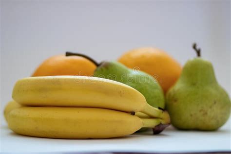 Oranges Pears And Bananas On A White Isolated Background Stock Image