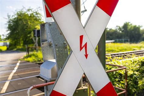 Guarded Railroad Crossing With Closing Barriers Red Warning Light And
