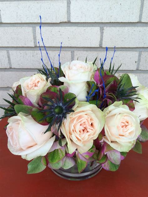 Factory wholesale high quality wedding flowers. Hydrangea, roses, and blue thistle centerpiece by KC ...