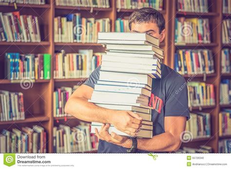 Student Carries Books In The Library Stock Photo - Image of learn, literature: 55726340