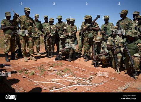 Zambian Soldiers Go Over A Pre Mission Brief Before Heading Out On Patrol During A Field
