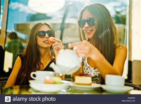 Women Having Coffee Together At Sidewalk Cafe Stock Photo Alamy