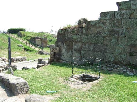 Castellum Acquae Pompeii. May 2006. Fenced water channel pit leading to ...