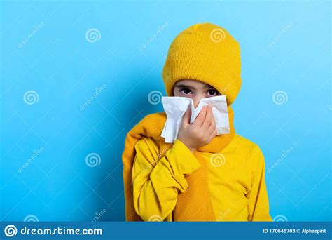 Child Caught A Cold And Wipes Her Nose Cyan Background Stock Image